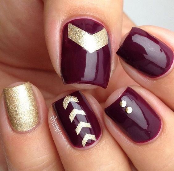 gold and purple-wine nails