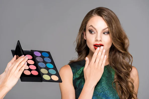 Partial View Makeup Artist Showing Eyeshadows Palette Shocked Model Isolated — стоковое фото