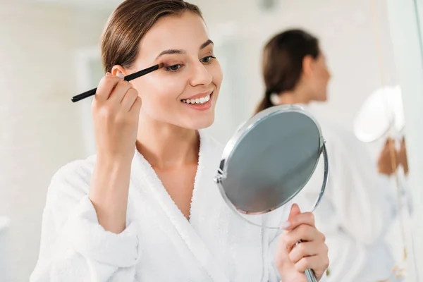 Beautiful Smiling Brunette Girl Applying Makeup Bathroom — стоковое фото