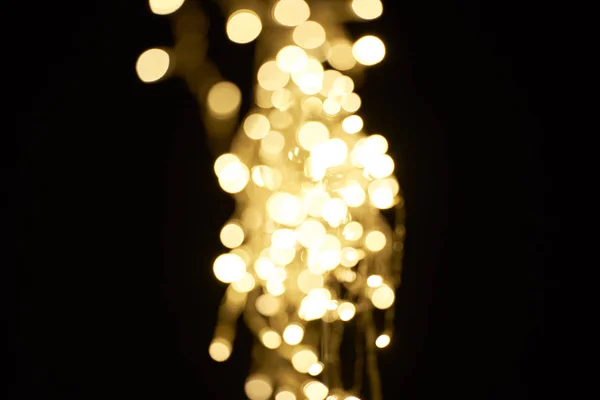 Beautiful Shiny Defocused Golden Bokeh Black Background — стоковое фото