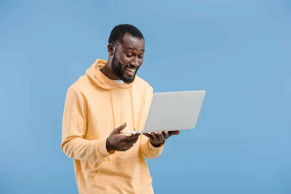 Happy Young African American Man Closed Eyes Holding Laptop Isolated — стоковое фото