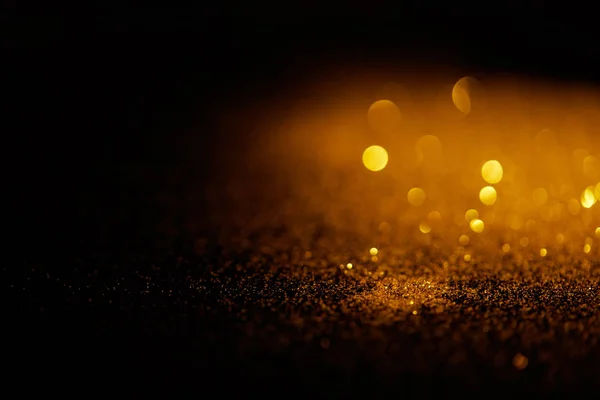 Blurred Gold Glitter Dark Background — стоковое фото