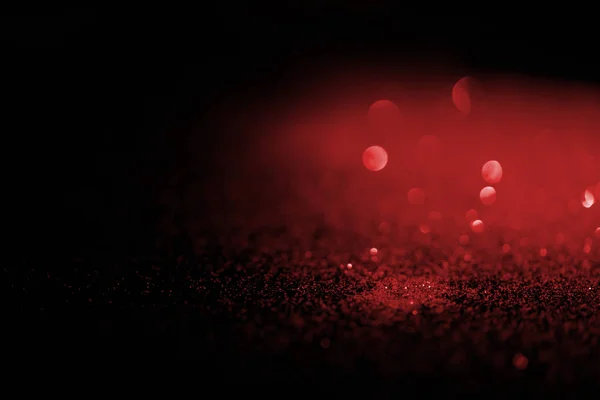 Blurred Red Glitter Dark Background — стоковое фото