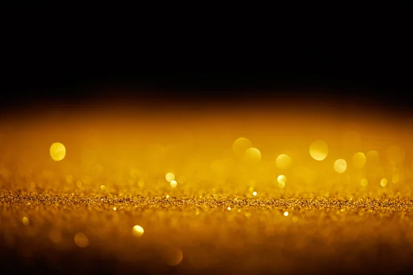 Sparking Gold Glitter Bokeh Black Background — стоковое фото